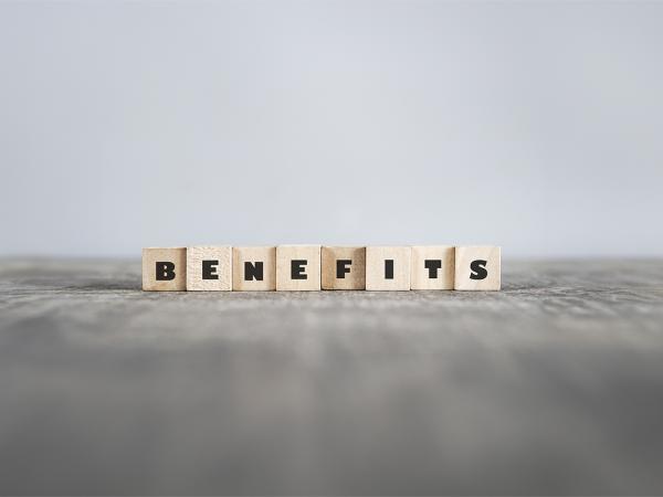 wooden scrabble tiles spelling out the word 'BENEFITS' 
