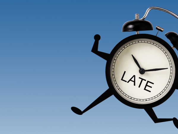 a clock with arms and legs running, on the clock face the word 'LATE' can be seen.
