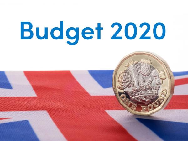 Pound coin on Union Jack flag representing the 2020 Budget