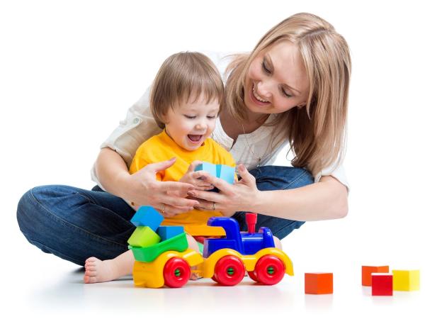 Woman with a child on her lap, playing with toys