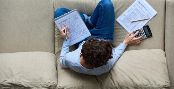 Man working out tax Working out your tax