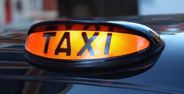 Image of a black cab taxi sign Image of a black cab taxi sign