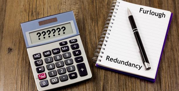 Image of a calendar and notepad with the words furlough and redundancy written down Image of a calendar and notepad with the words furlough and redundancy written down