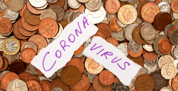 Image of scattered coins and paper with coronavirus written on it Image of scattered coins and paper with coronavirus written on it