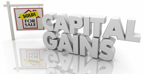 Image of the words capital gains and a for sale sign Image of the words capital gains and a for sale sign