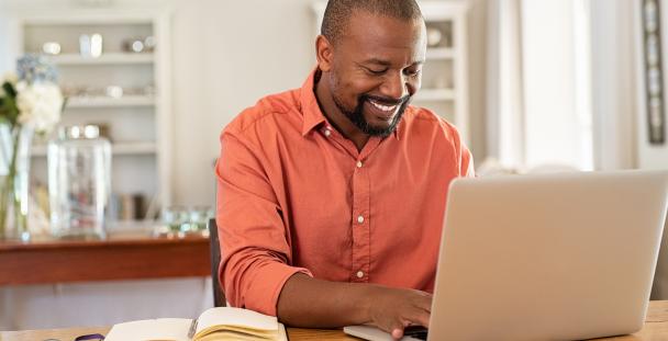 Man working on a laptop at home Man working on a laptop at home