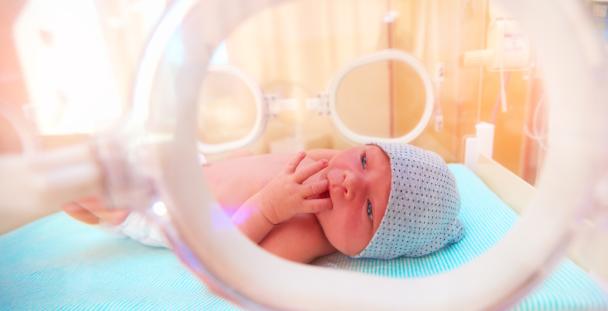 Good Work Plan: Proposals to support families – neonatal leave and pay newborn baby lying inside the infant incubator in hospital