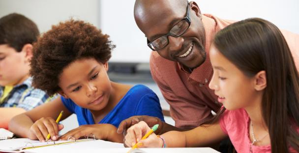 Teachers’ employment expenses tax relief – what you need to know teacher helping students