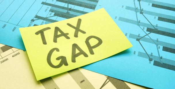 Image of a note with the words tax gap on it Image of a note with the words tax gap on it