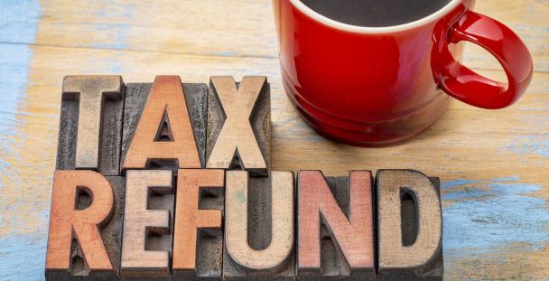 Image of the words tax refund and a mug of coffee Image of the words tax refund and a mug of coffee