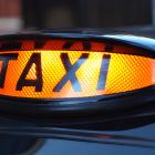 Image of a black cab taxi sign