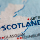 Image of Scotland on a map with a pin next to it