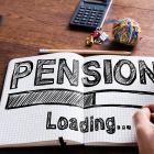 Image of a man writing pension... loading in a notebook