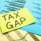 Image of a note with the words tax gap on it