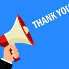 thank you man with megaphone LITRG blue background shutterstock_1227768562.jpg