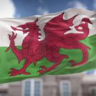 Image of the Welsh flag in front of a building