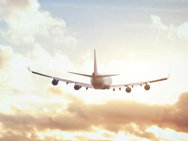 an aeroplane taking off into the clouds 