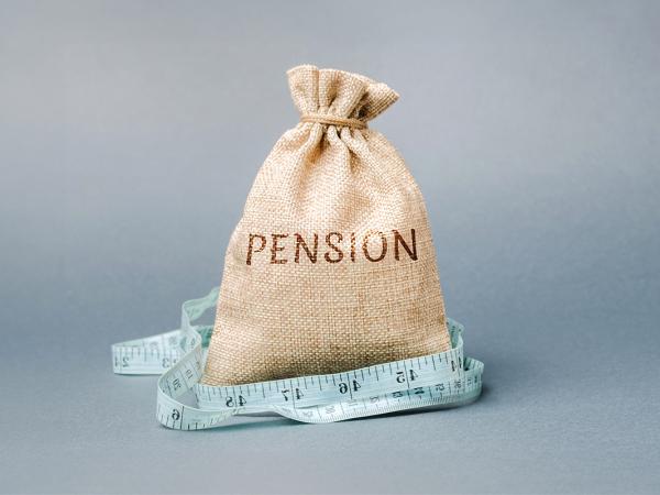 a burlap sack with the word 'PENSION' on the front, around the sack a fabric tape measure can be seen