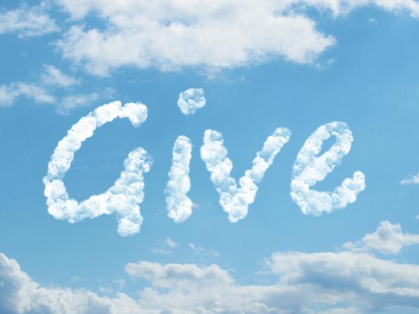 a blue sky with a scattering of white clouds, in the centre is the word 'GIVE' written in clouds. 