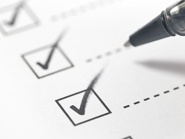 a person ticking a checklist