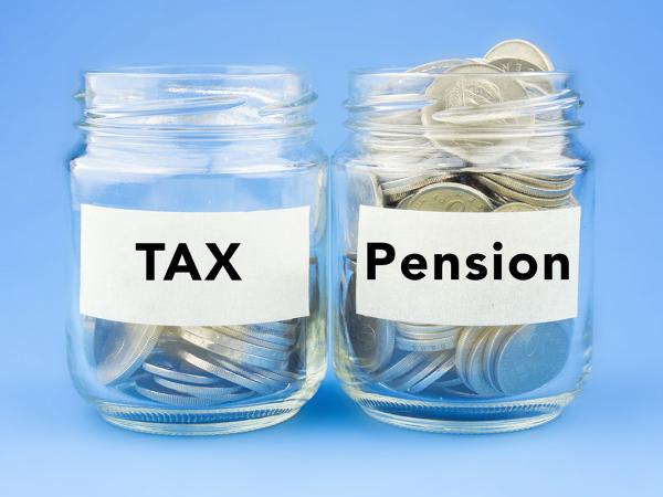 2 glass jars of coins, both have labels on them, one says 'TAX' and the other 'PENSION'