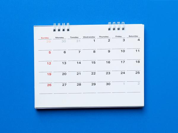 a month per page calendar against a blue background.