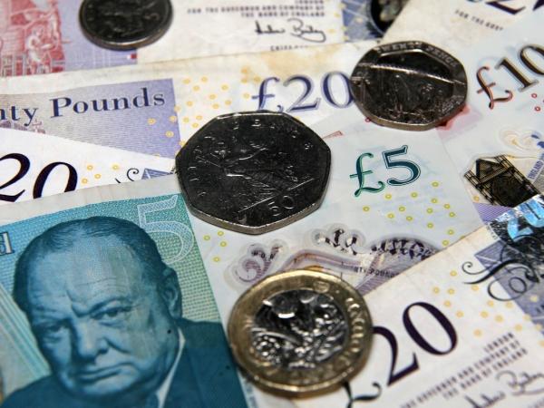 Various UK bank notes and coins.