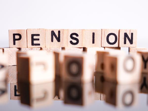 Wooden blocks that spell out the word 'PENSION'.