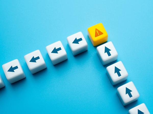 Small blocks with arrows on them in a row pointing upwards, then a warning triangle block, from here the arrow blocks point to the left and head in that direction.