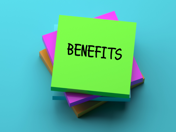 Pile of post-it notes the top note reads 'BENEFITS'.