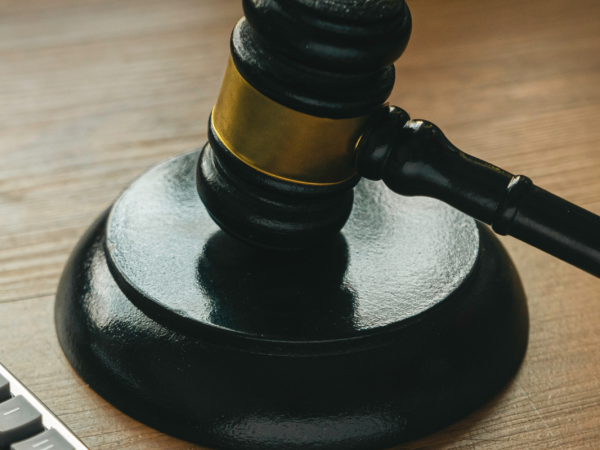 A calculator, a judges hammer and gavel. 