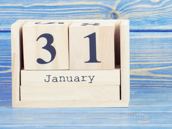 A wooden block calendar showing the date 31 January