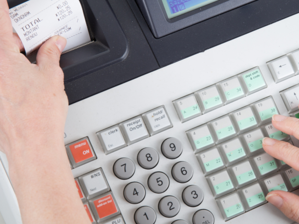A till printing a receipt.