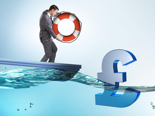 A man on a boat with a life ring, floating in the water a £ sign can be seen. 