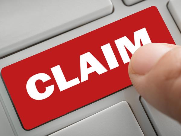 A red computer key with the word 'CLAIM' on it in white text.