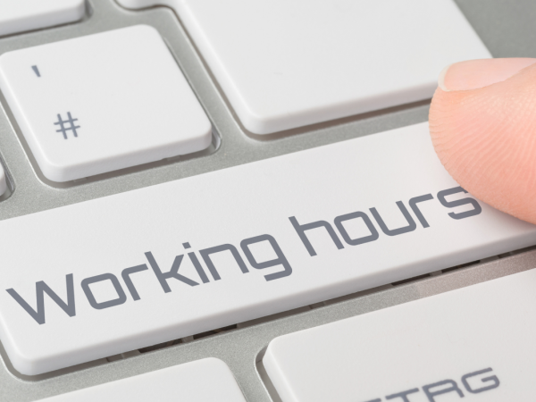 a keyboard with a key saying 'WORKING HOURS' 
