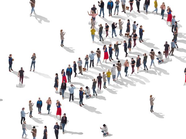 People stood against a white background, arranged in the shape of a question mark.