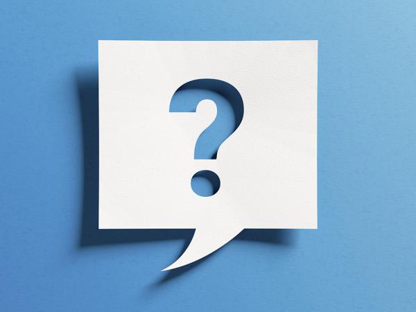 A white speech bubble box with a '?' inside against a blue background.