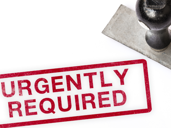 a hand stamp with the print of the stamp next to it that reads 'URGENTLY REQUIRED' in red ink with a red box around it.