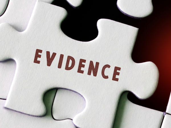 a white jigsaw missing one piece, the missing piece has the word 'EVIDENCE' on it. a white jigsaw missing one piece, the missing piece has the word 'EVIDENCE' on it.