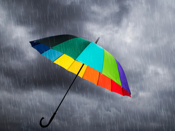 a grey sky with a colourful umbrella a grey sky with a colourful umbrella