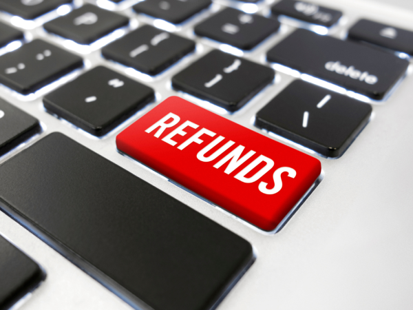 A computer keyboard, one of the keys are red coloured with the word 'REFUNDS' in white text.