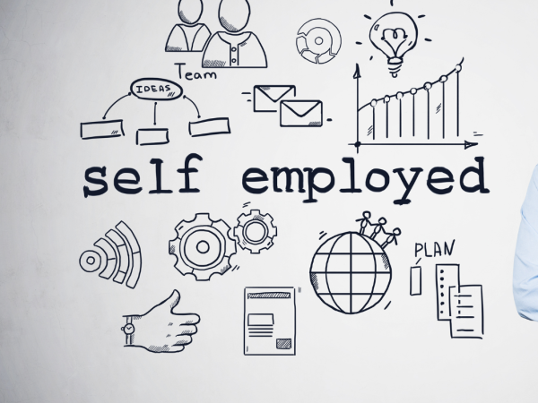 A person stood next to a wall containing the words 'SELF EMPLOYED' with various icons of cogs, wifi, email, team work, lightbulb, thumbs up etc. A person stood next to a wall containing the words 'SELF EMPLOYED' with various icons of cogs, wifi, email, team work, lightbulb, thumbs up etc.