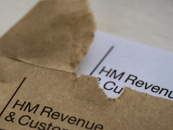An open HMRC envelope and letter showing the HMRC logo in the top left corner. An open HMRC envelope and letter showing the HMRC logo in the top left corner.
