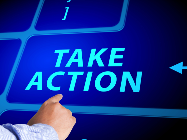 a giant virtual keyboard, a person pressing the button that says 'TAKE ACTION' a giant virtual keyboard, a person pressing the button that says 'TAKE ACTION'