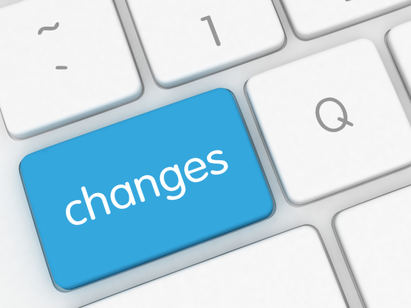 A white keyboard with a blue key, this key reads the word 'CHANGES' in white text.