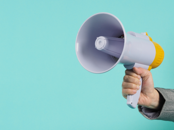 A person holding a megaphone A person holding a megaphone