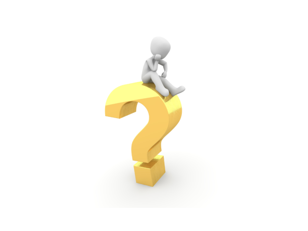 A person sat thinking on top of a large golden coloured question mark. A person sat thinking on top of a large golden coloured question mark.