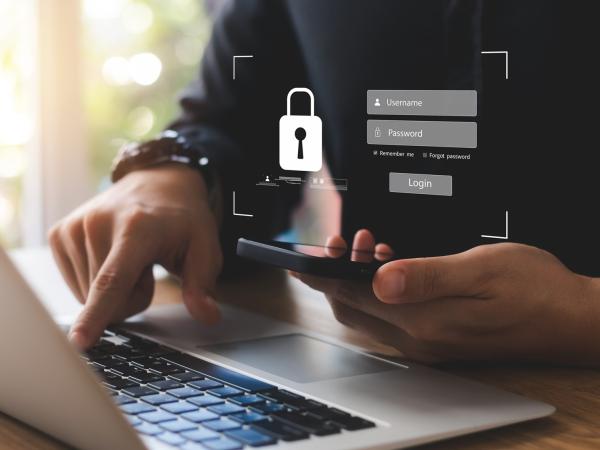 hand_and_smartphone_laptop_graphic_of_padlock hand_and_smartphone_laptop_graphic_of_padlock.jpg