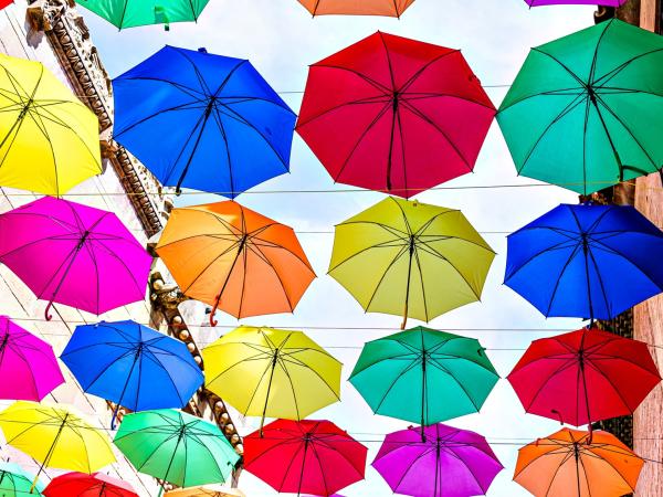 many_hanging_colourful_umbrellas